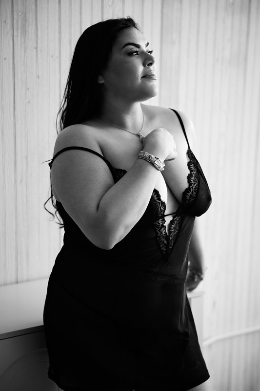 woman wearing a slip dress during a boudoir photoshoot